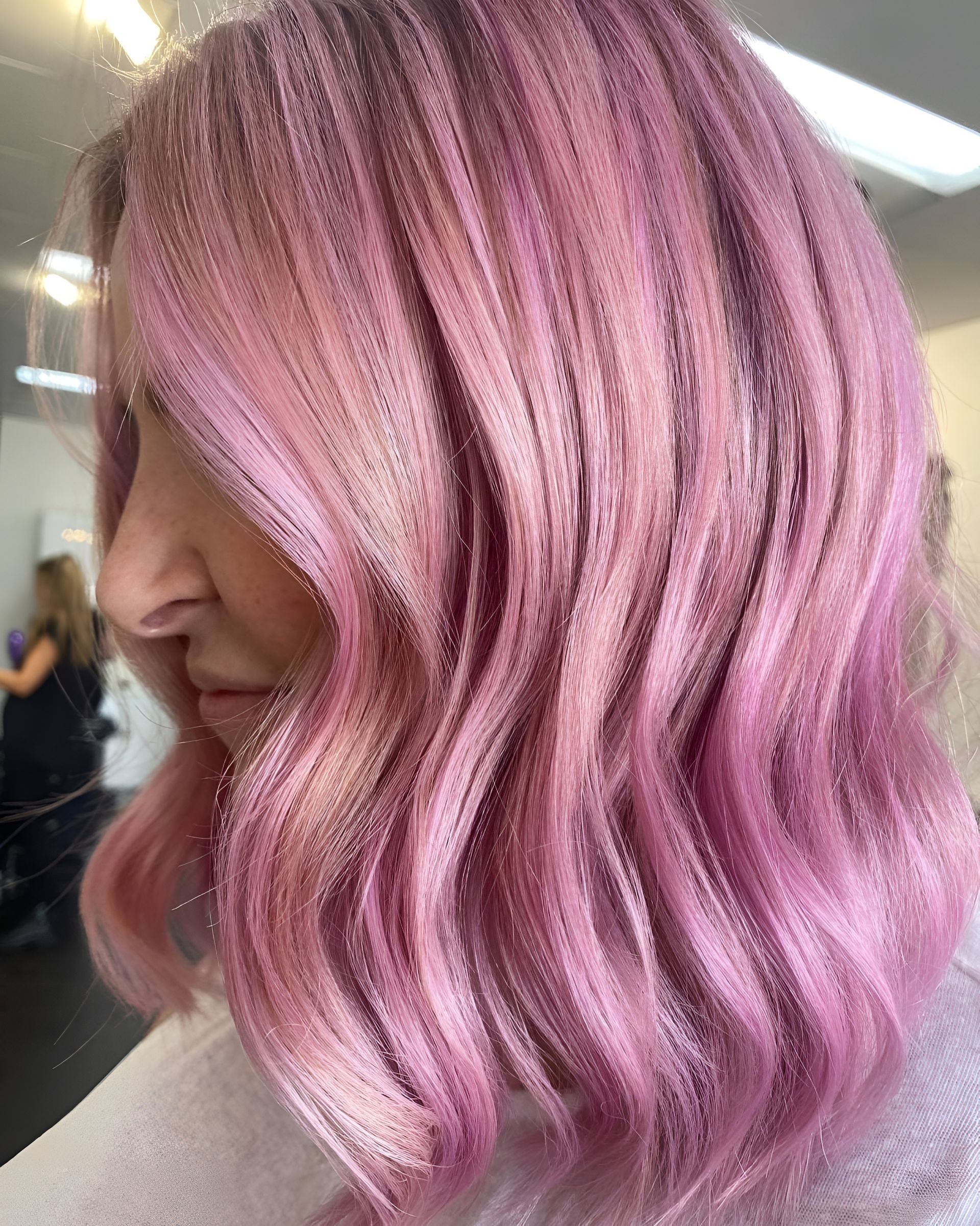 Woman With Shoulder-length Pink Wavy Hair in a Salon — 5th Ave Hair Lounge in Caloundra, QLD