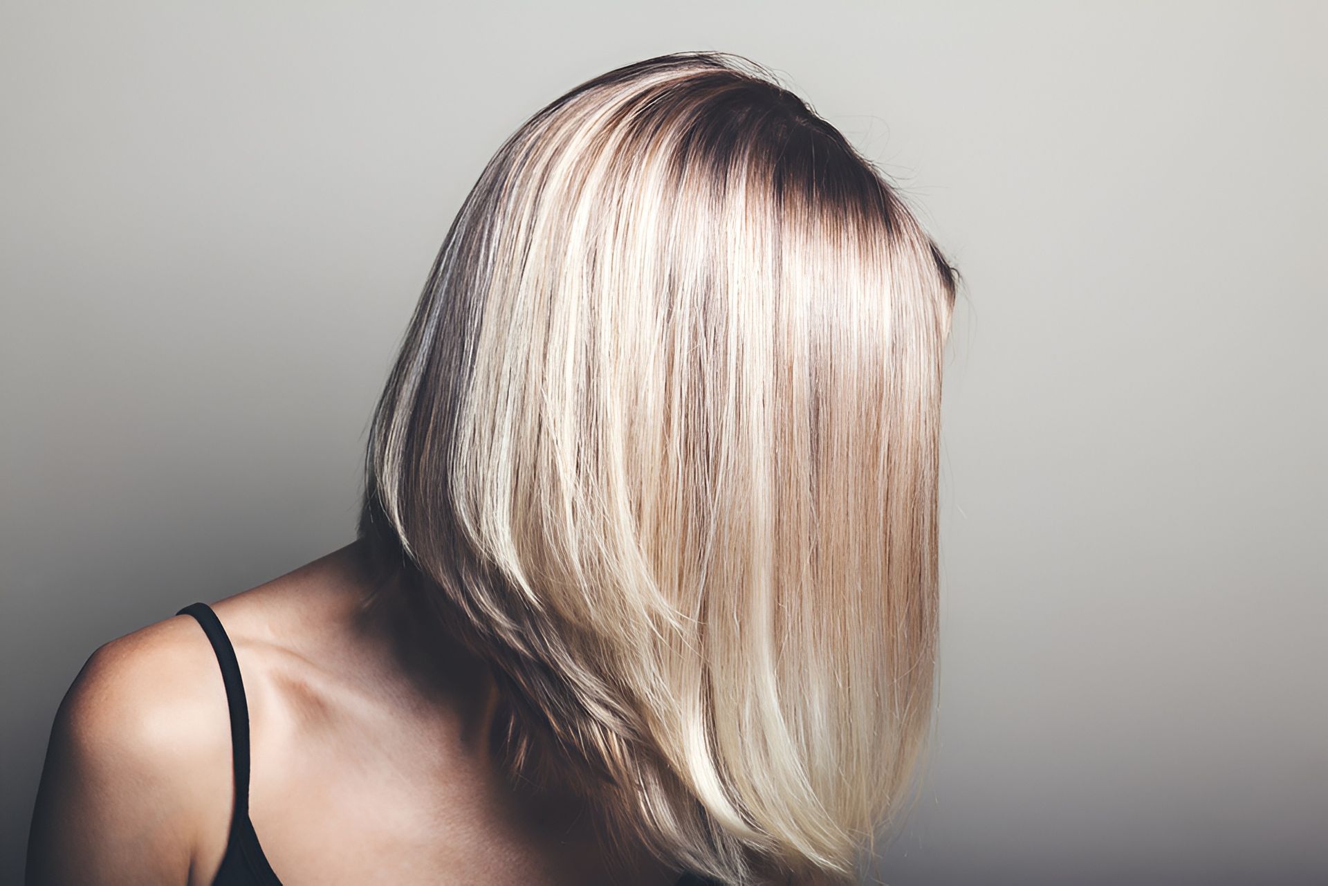 Woman With Blonde Ombre Hair, Partially Obscuring Her Face — 5th Ave Hair Lounge in Caloundra, QLD
