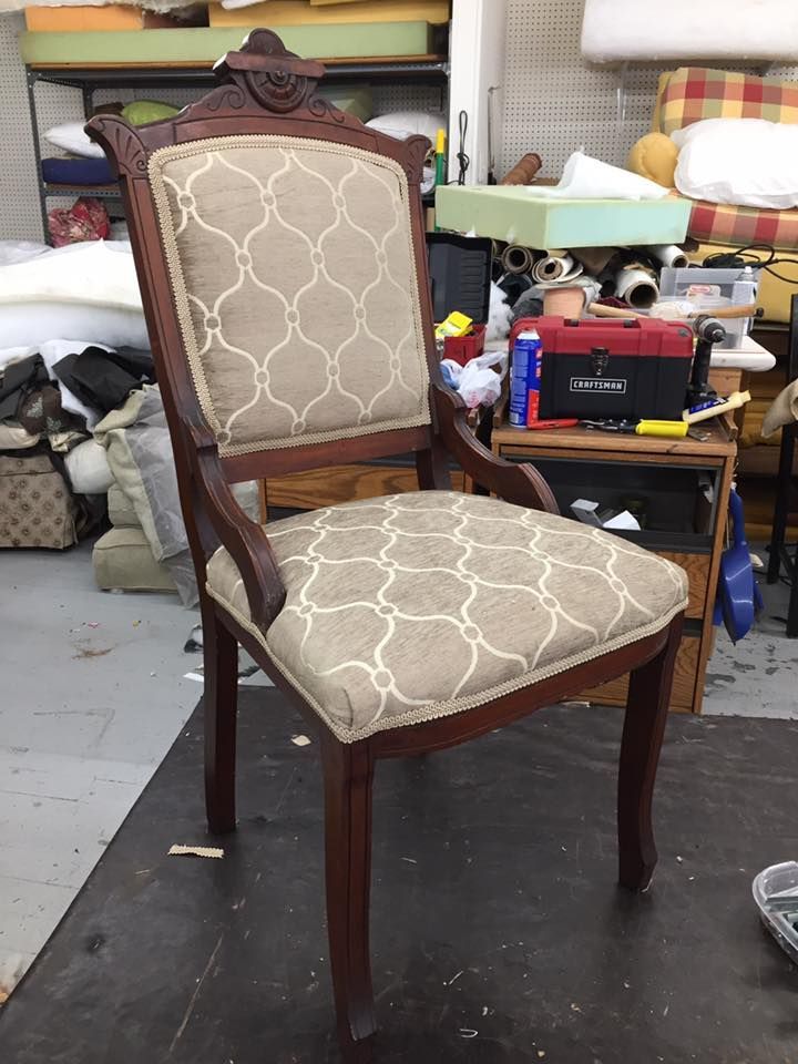 A chair is sitting on a table in a room.