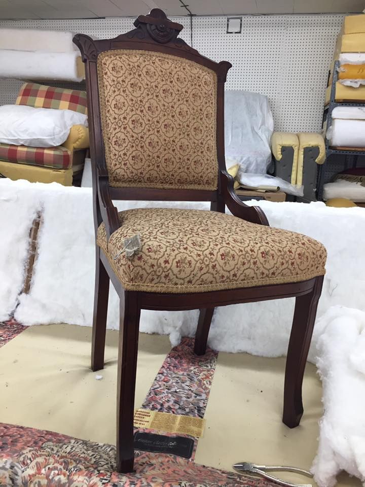 A chair is sitting on a rug in a room
