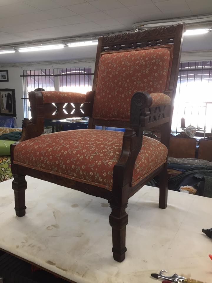 A chair is sitting on a table in a room.