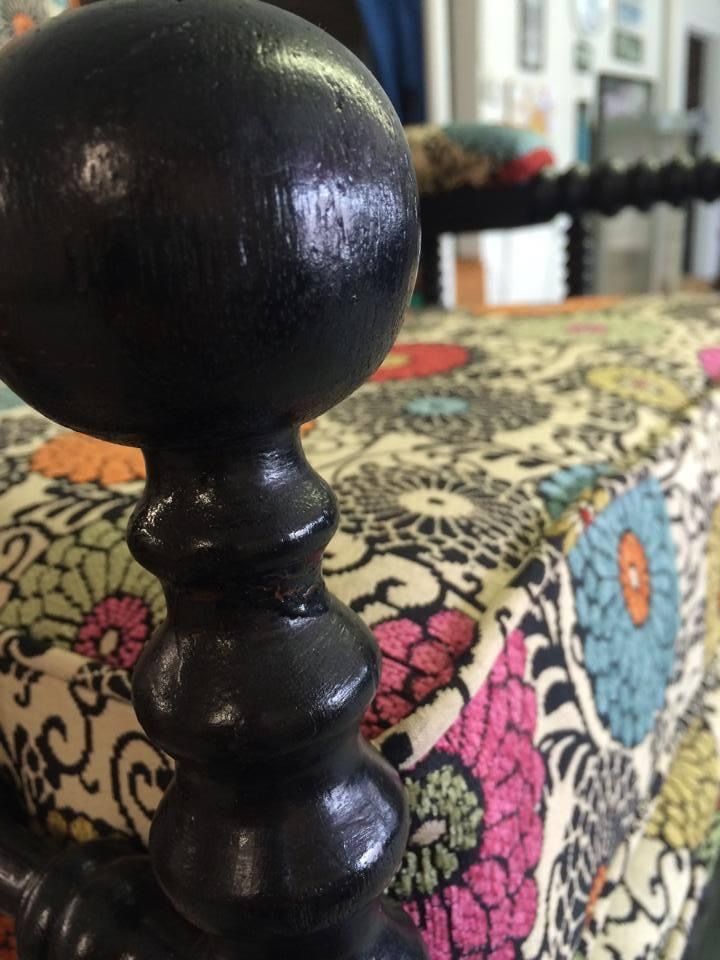 A close up of a chair with a floral pattern on it