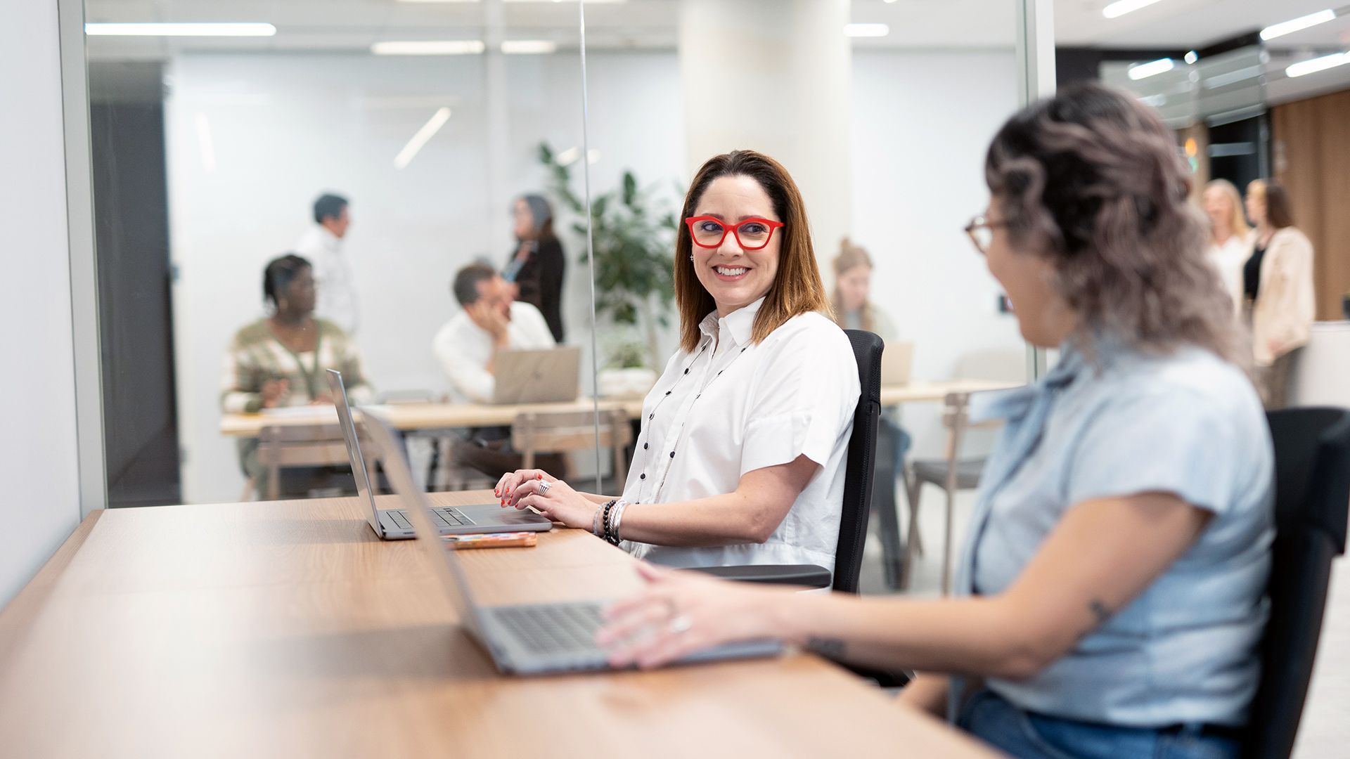 two women in a shared desk area