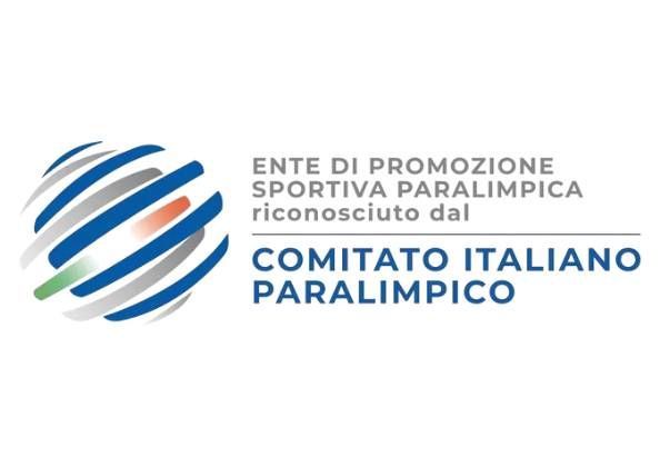 Coppia che balla il tango, lei con un abito rosso, lui con un abito nero, vicino a un'antica struttura in pietra.