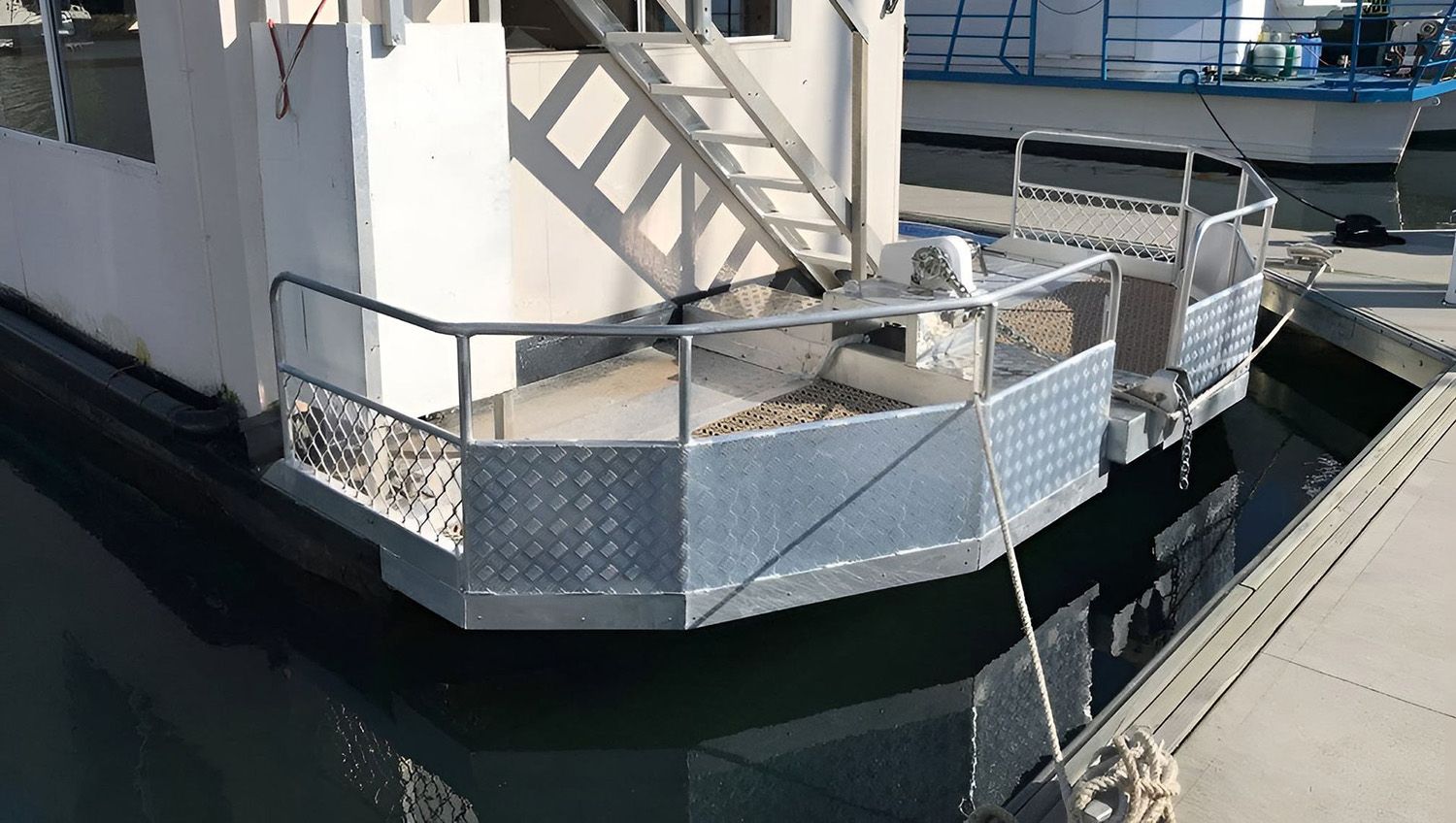 Boat Stern With Metal Railing And Diamond Plate Siding