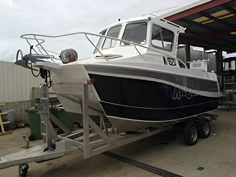 A Boat On A Trailer With The Number 100 On The Side — Brumb's Welding & Fabrication in Biggera Waters, QLD