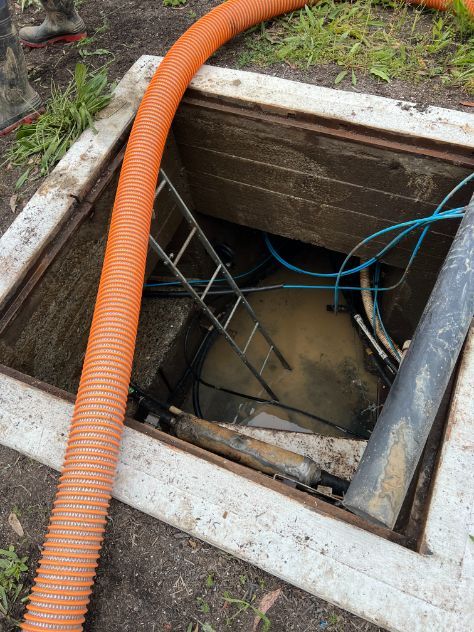 A Manhole Cover With A Ladder And A Hose In It — MCR Hydro Excavations & VAC Truck Services In Belmore River, NSW