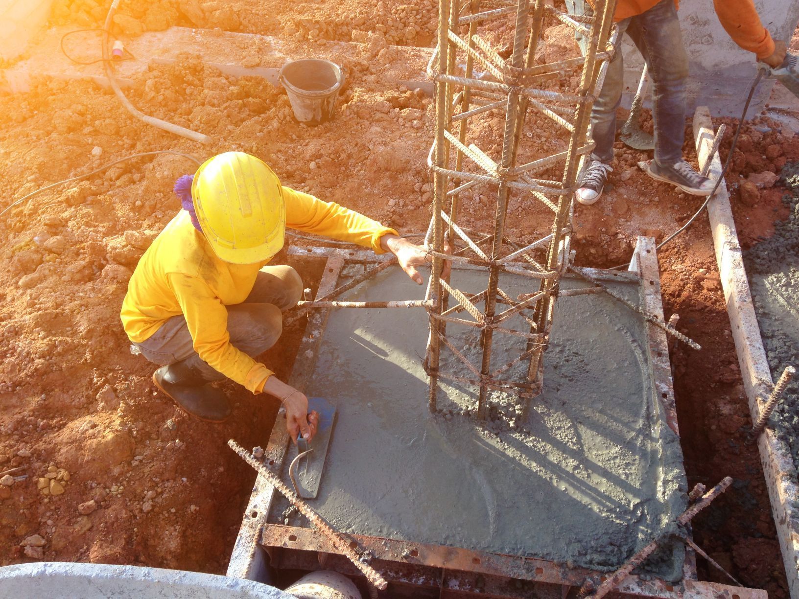 mason leveling scrape concrete foundation