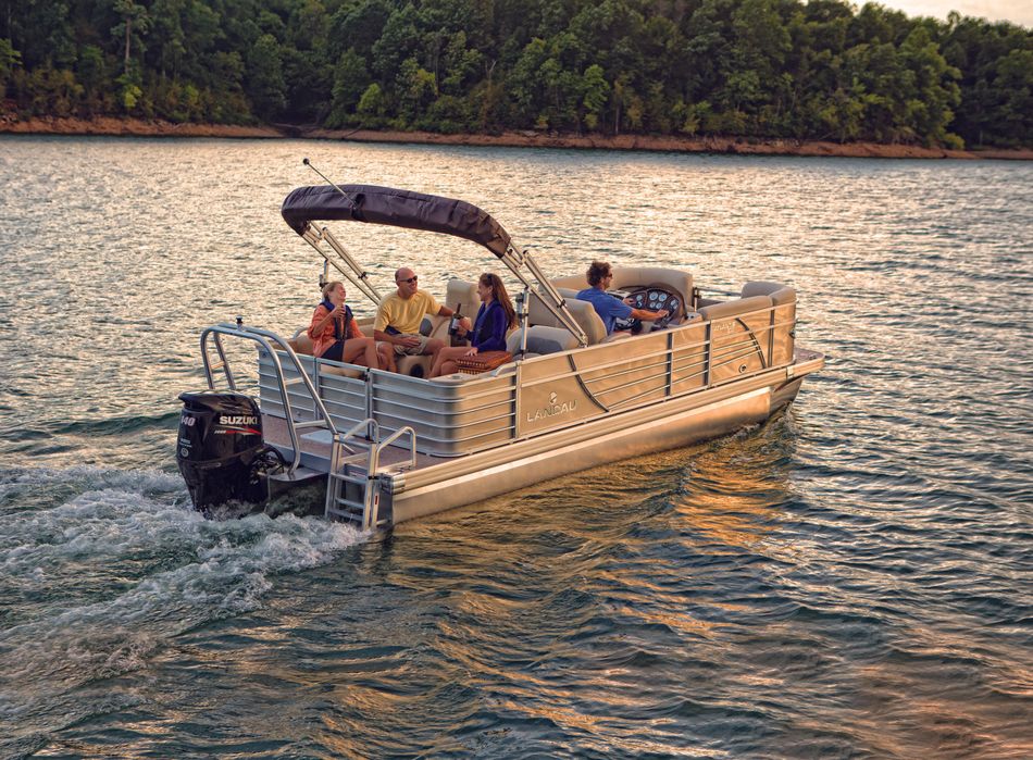 Dirty Duck Boat Rentals | Lake of the Ozarks a group of people are riding a pontoon boat on a lake