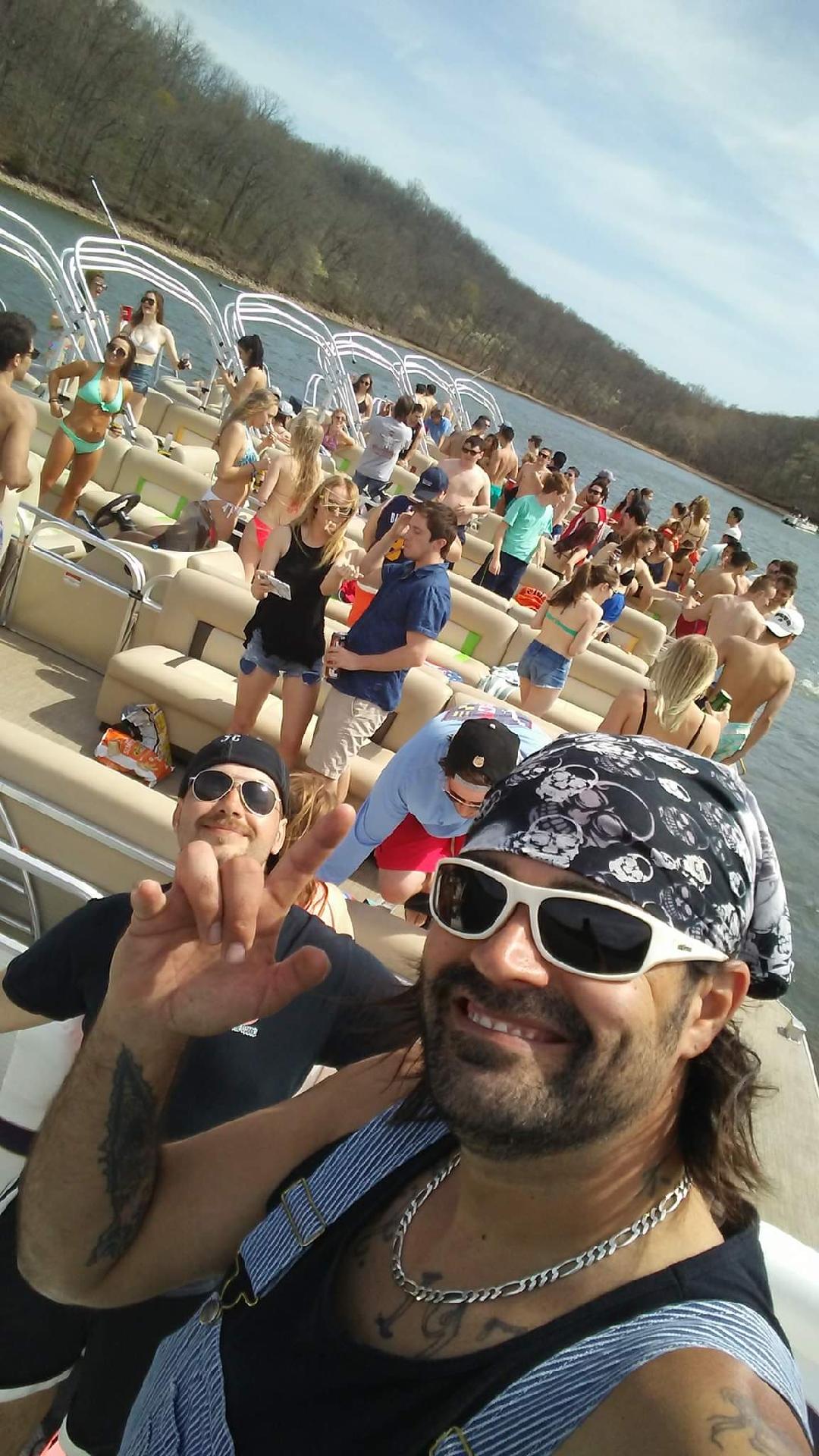 Dirty Duck Boat Rentals | Lake of the Ozarks poses for a picture on a boat