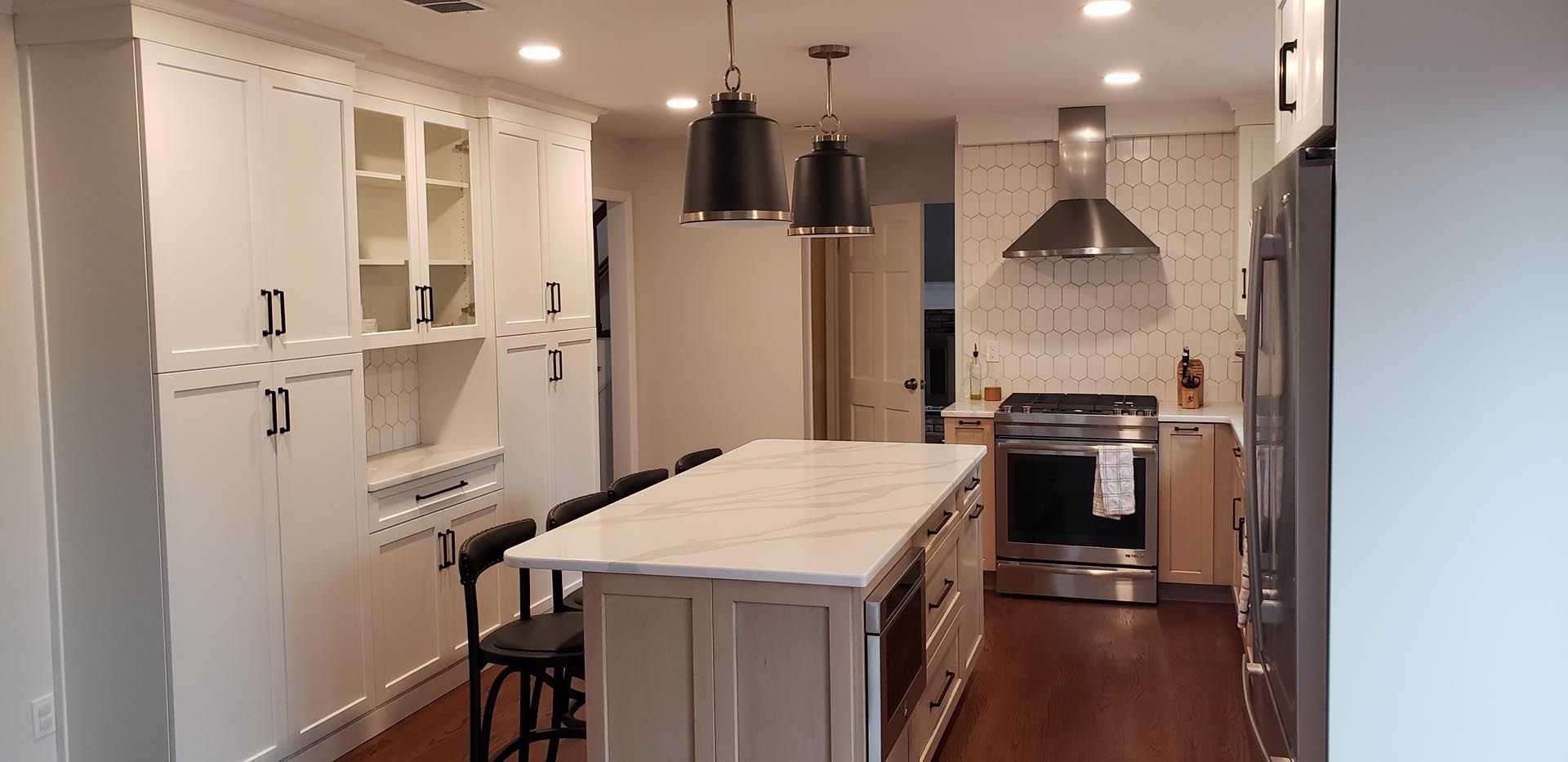 There is a large island in the middle of the kitchen.