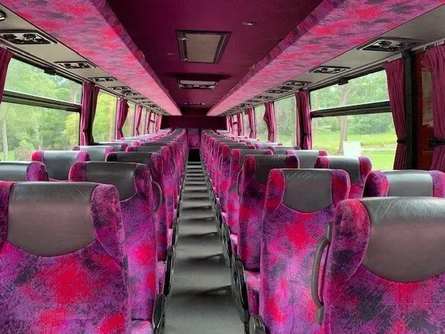 The Inside of a Bus With Purple Seats and a Purple Ceiling — Wests National Coaches In Chevallum, QLD