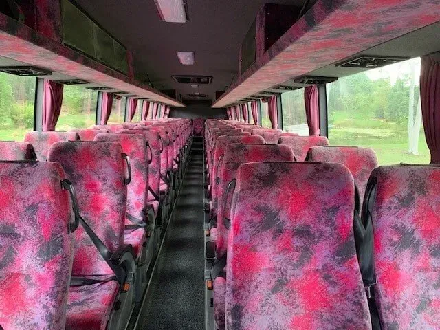The Inside of an Empty Bus With Red and Black Seats — Wests National Coaches In Chevallum, QLD
