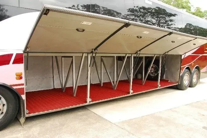 A Large Bus With the Doors Open and a Red Carpet — Wests National Coaches In Chevallum, QLD