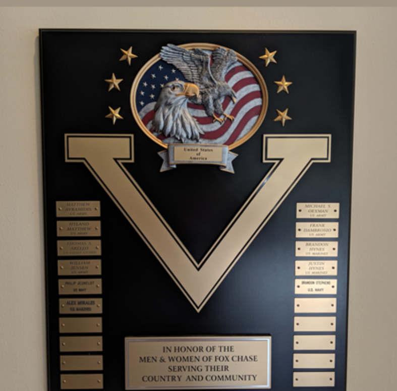 a plaque that says in honor of the men and women of fox chase serving their country and community