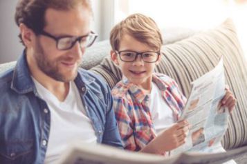 Safety Classes — Father and Son Wearing Eye Glasses While Reading News Paper  in Rockingham, NC