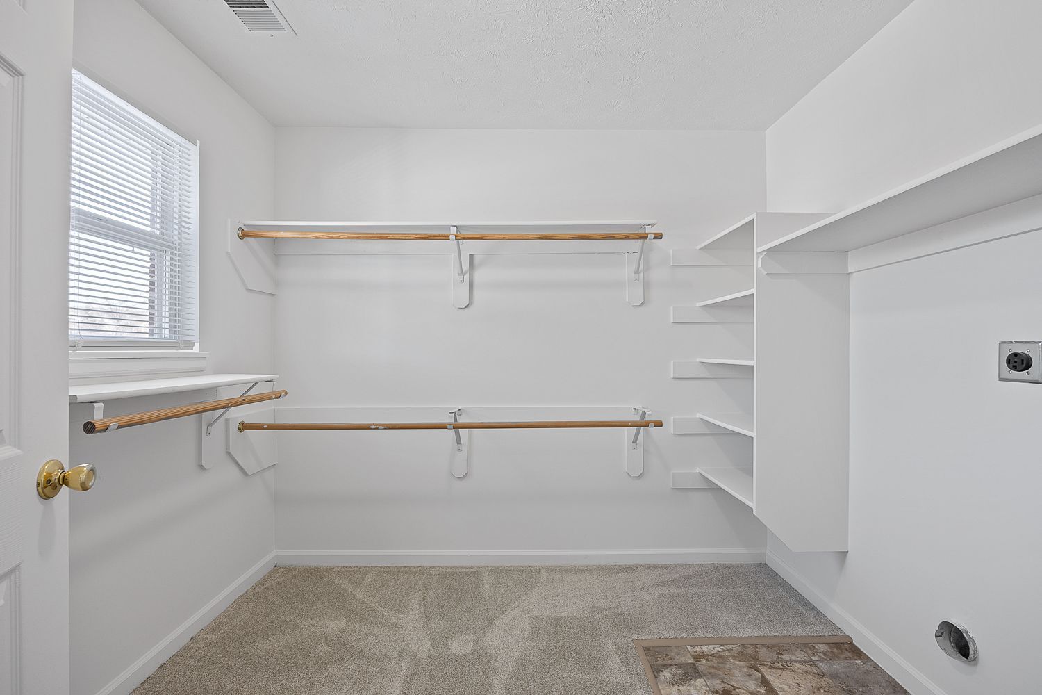 The Elm floor plan walk-in closet with shelving, washer & dryer hook-ups and hanging space.