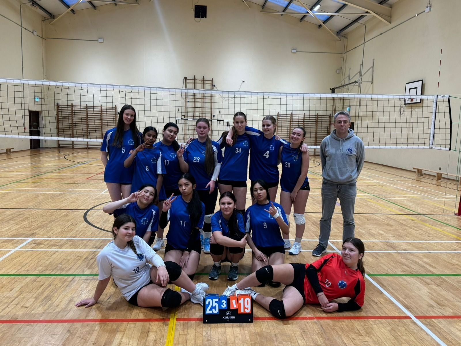 A group of young men are posing for a picture together.