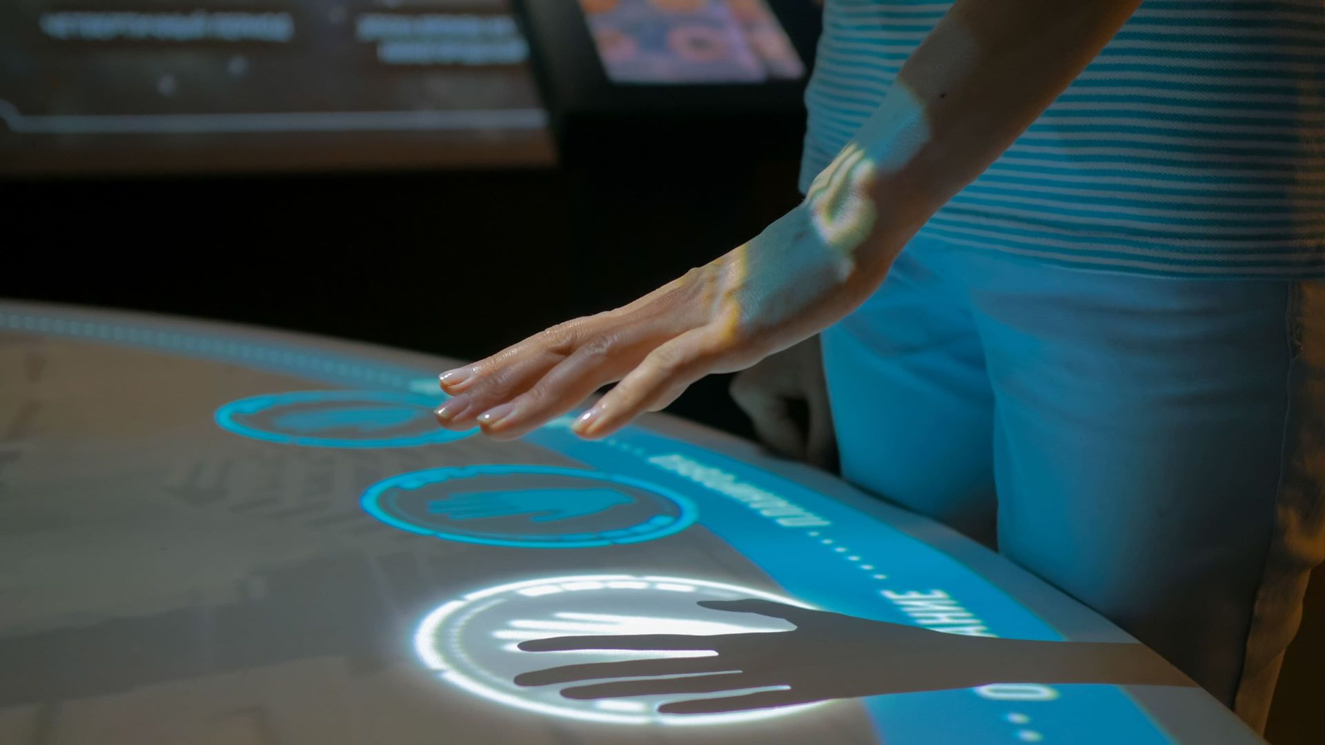 a person is touching a screen with their hands .