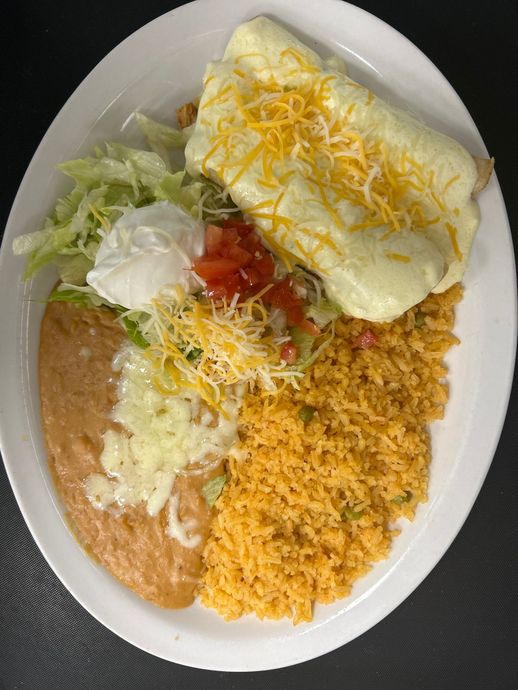 A white plate topped with rice , beans , and a burrito.