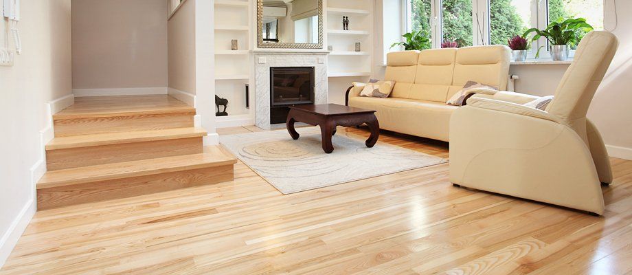 a cream livingroom with polished floorboards