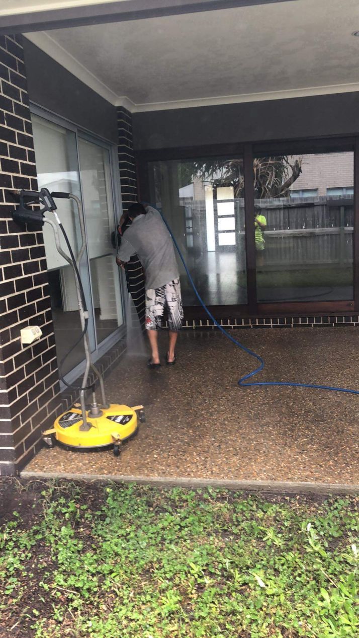 Man Cleaning The Floor Verandah Using Pressure Washer — Cleaners in Sunshine Coast, QLD