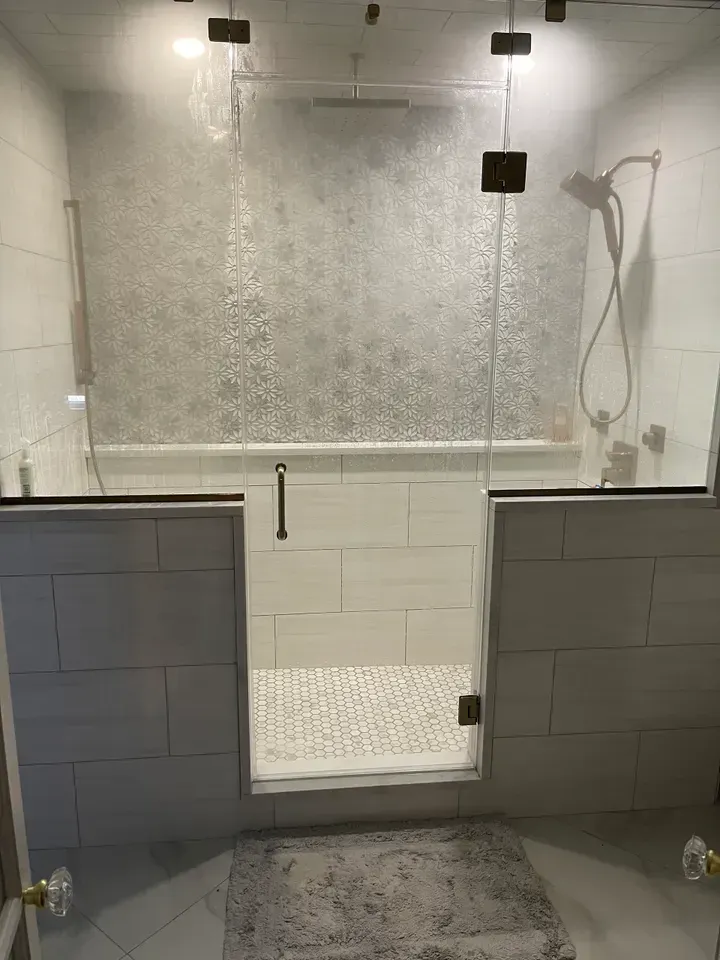 Bright white kitchen with stainless steel appliances, granite countertops, and two crystal pendant lights. Bright white kitchen with stainless steel appliances, granite countertops, and two crystal pendant lights.