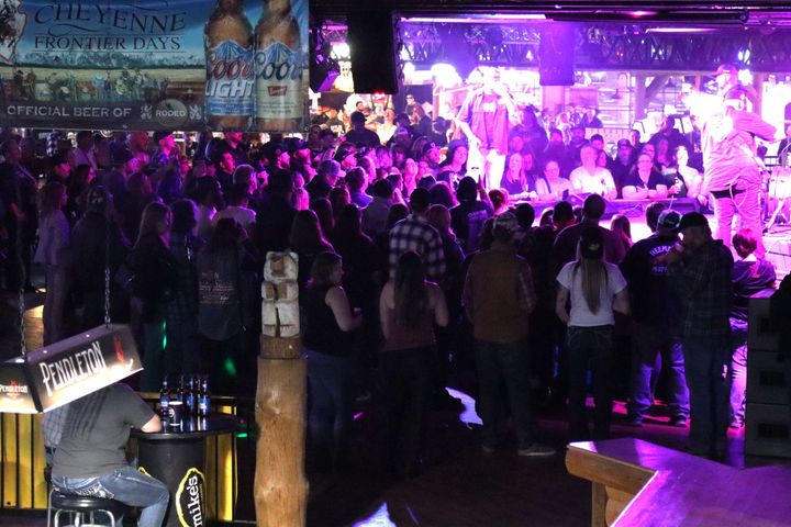 A large crowd of people are gathered at a cheyenne event