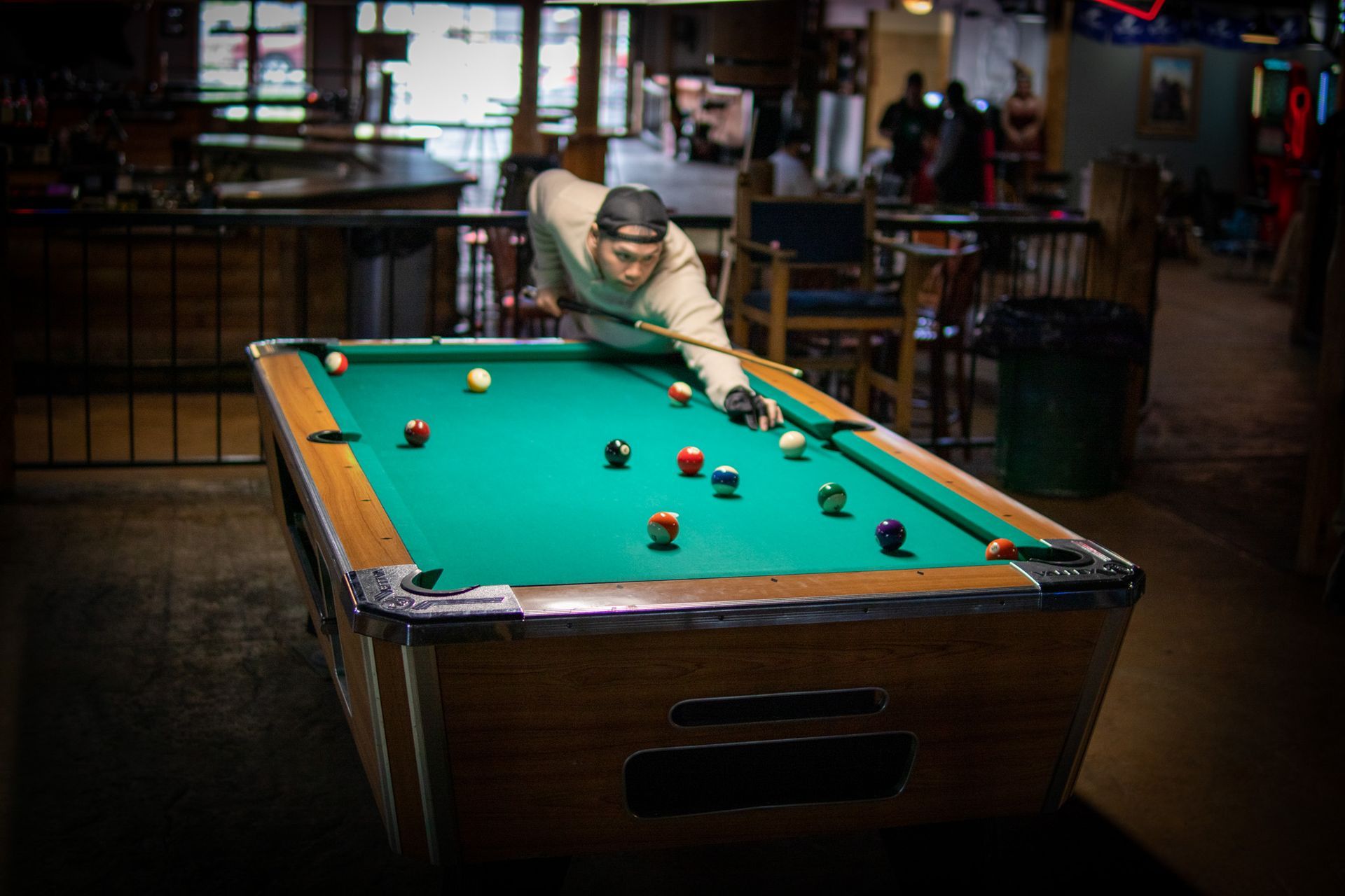 A man is playing a guitar on a stage in front of a crowd.