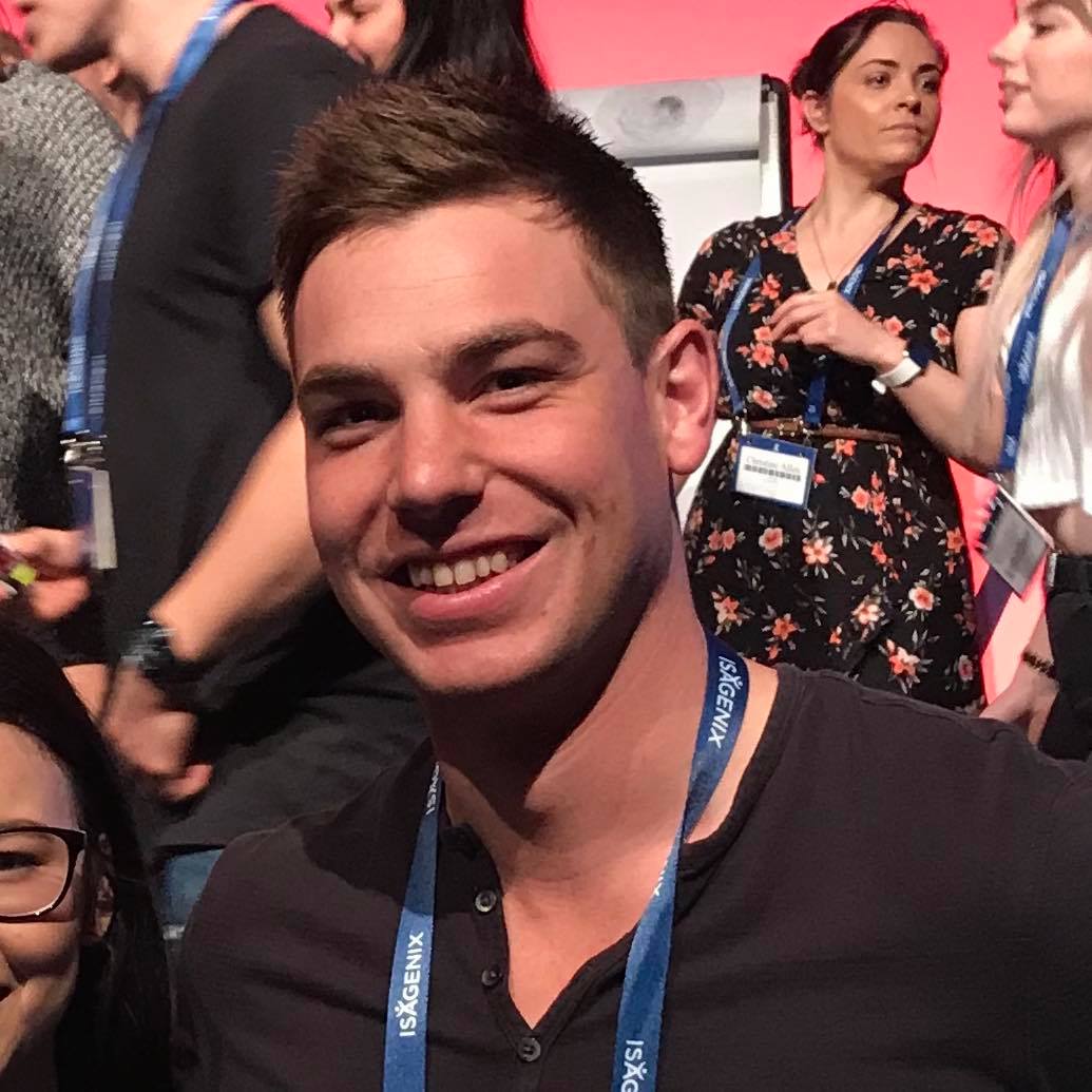 A man with a lanyard around his neck that says ' ibm ' on it