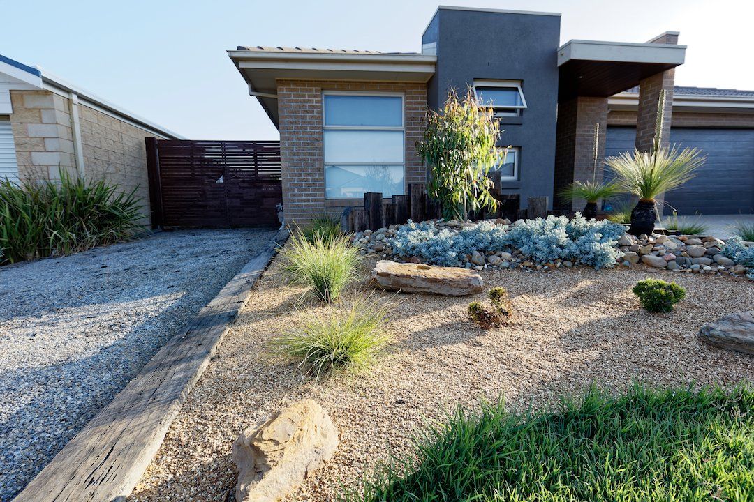 A house with a lot of rocks in front of it