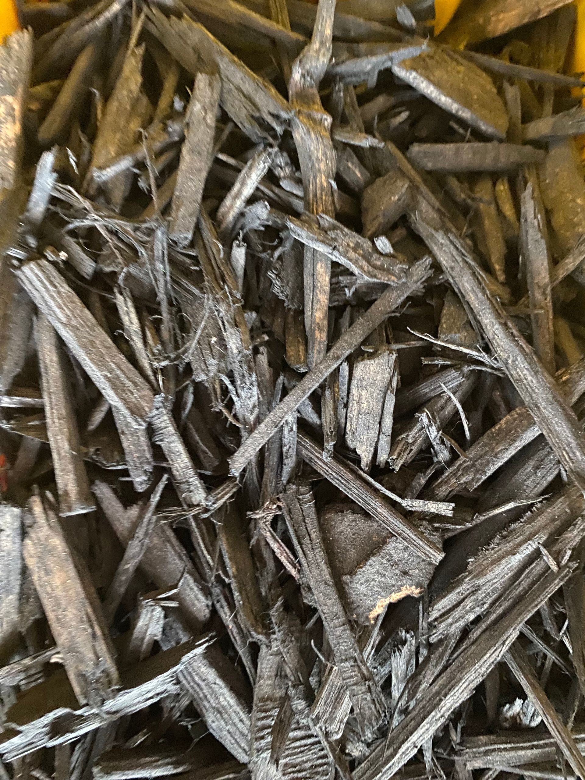 A pile of wood chips sitting on top of each other on a table.