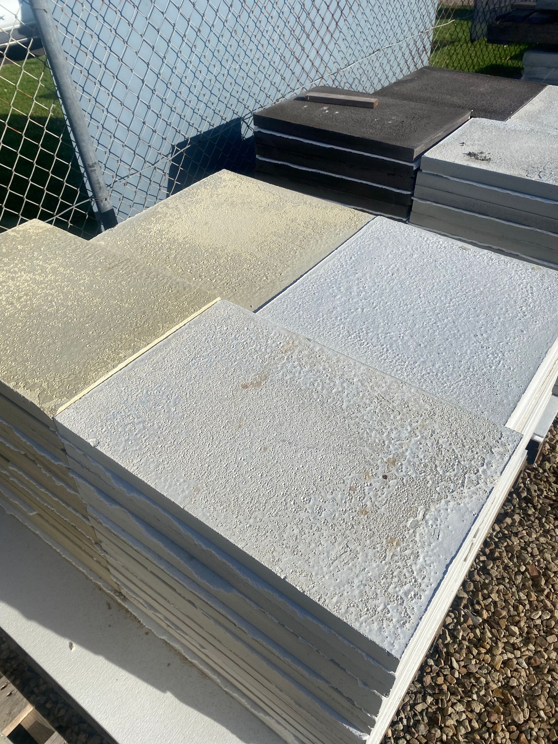 A stack of tiles sitting on top of each other on a table.