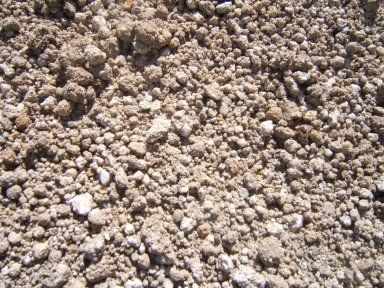 A pile of dirt and rocks is sitting on the ground.
