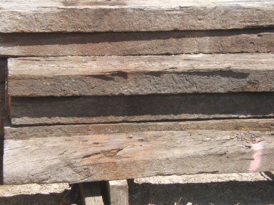 A stack of wooden boards sitting on top of each other