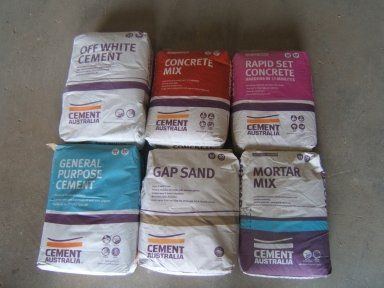 Several bags of cement are stacked on top of each other