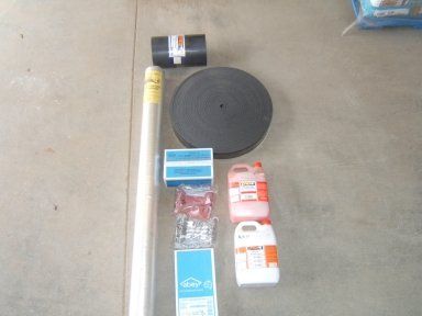 A bunch of items laying on a concrete floor