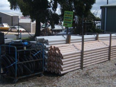 A bunch of pipes are stacked on top of each other