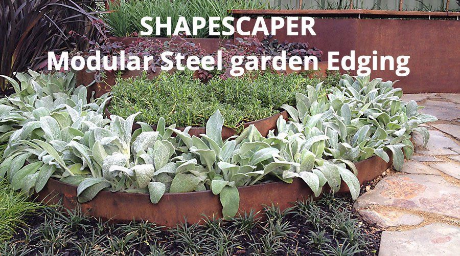 A picture of a garden with the words shapescaper modular steel garden edging