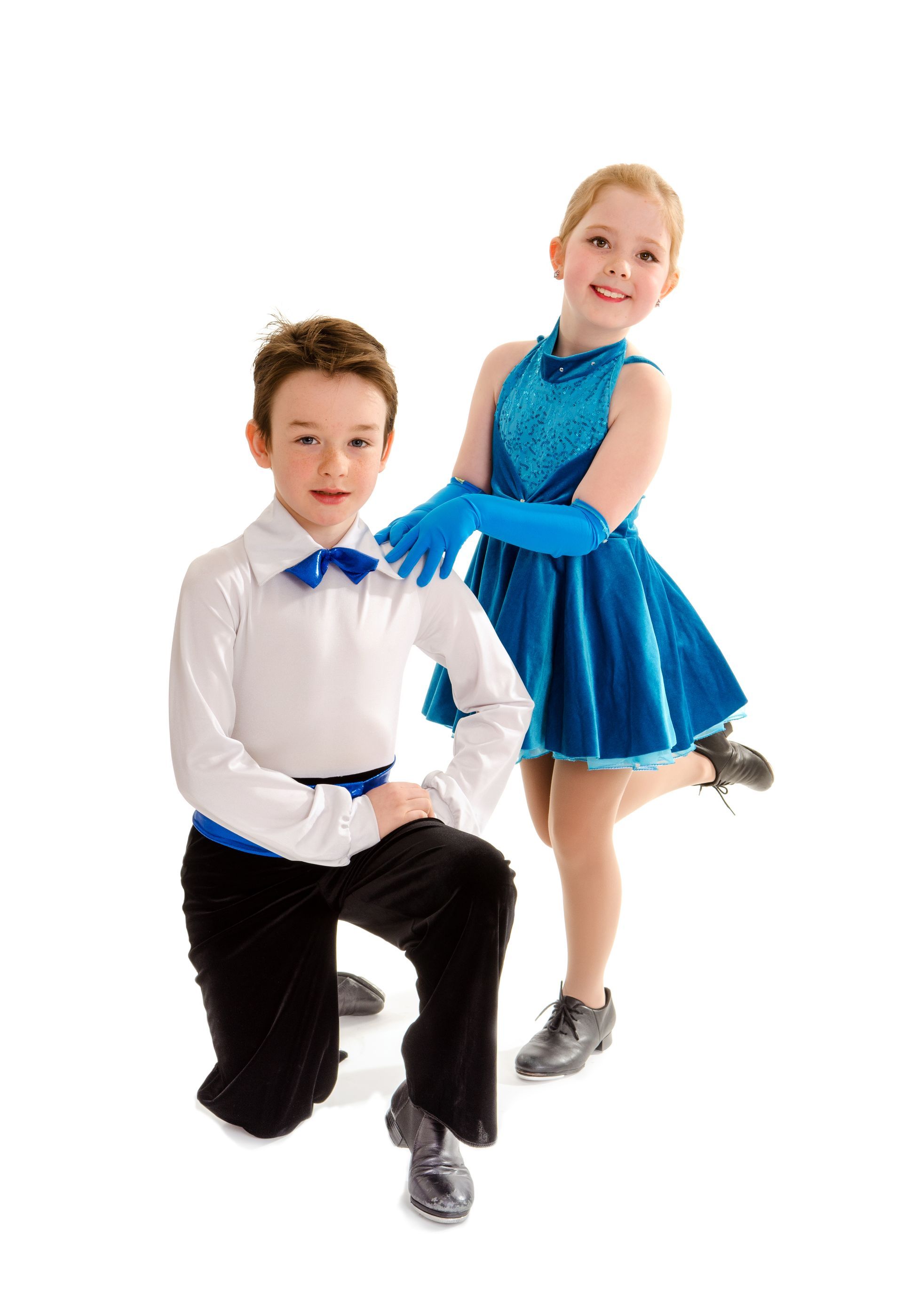 A boy and a girl are kneeling next to each other.