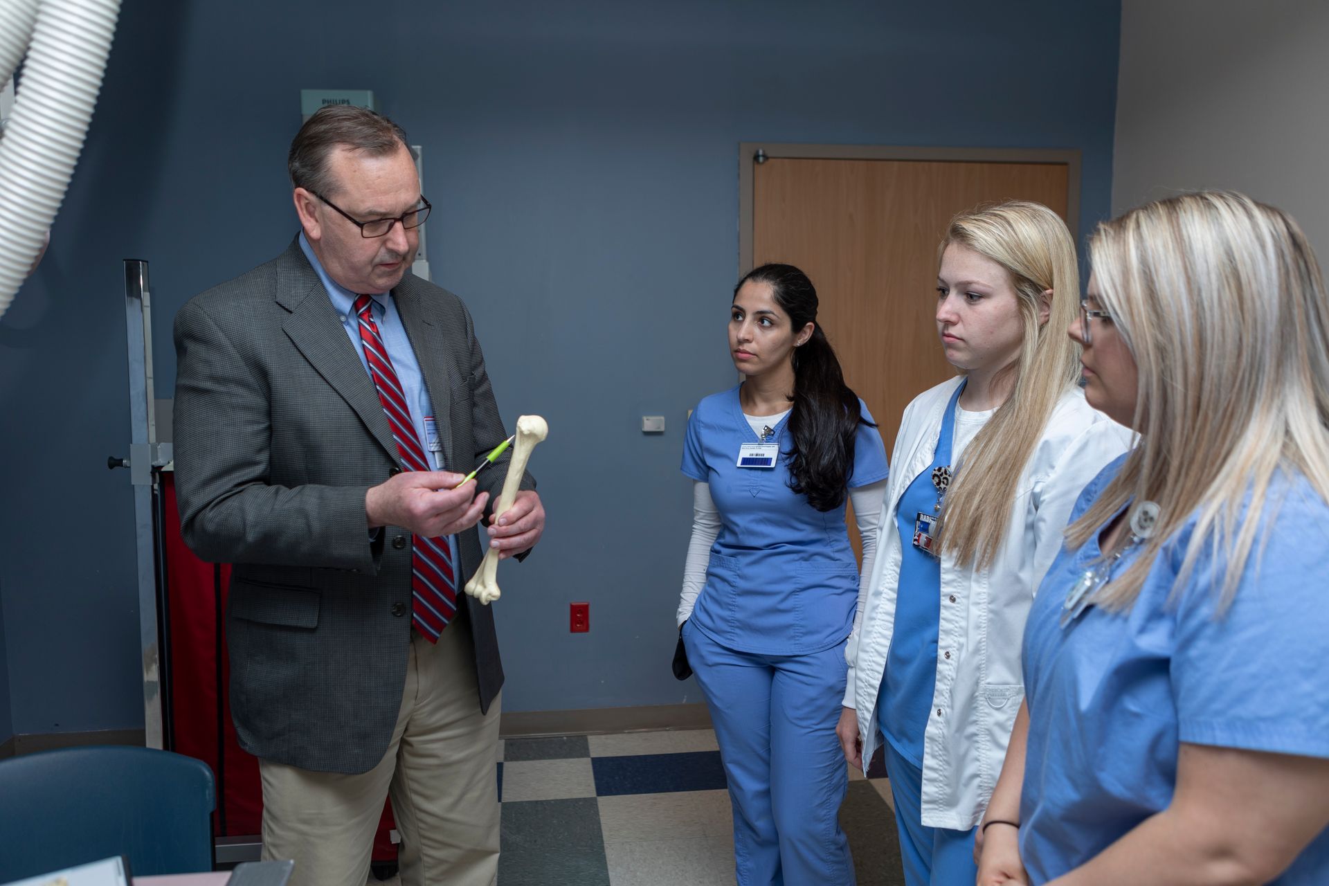 Professor Holding Bone — Nashville, TN — NGH School of Health Sciences Professor Holding Bone — Nashville, TN — NGH School of Health Sciences