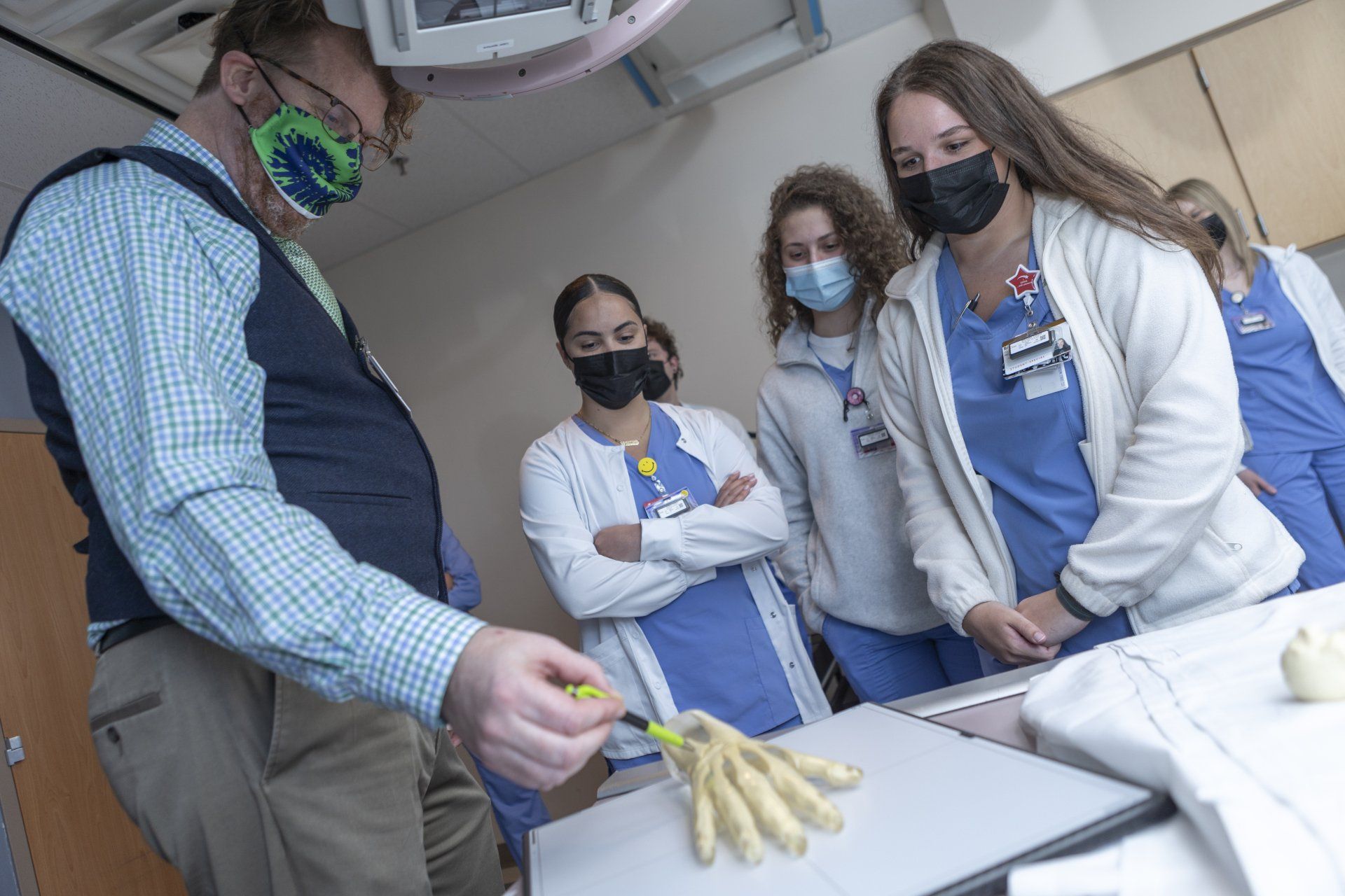 Professor Explaining Hand Bone — Nashville, TN — NGH School of Health Sciences