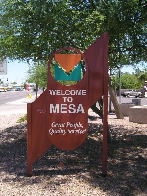 A sign that says welcome to mesa great people quality service