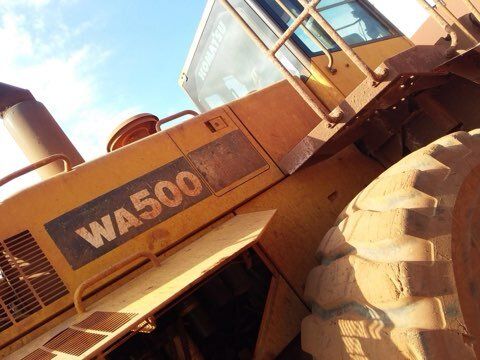 Yellow Komatsu WA500 heavy equipment machine.