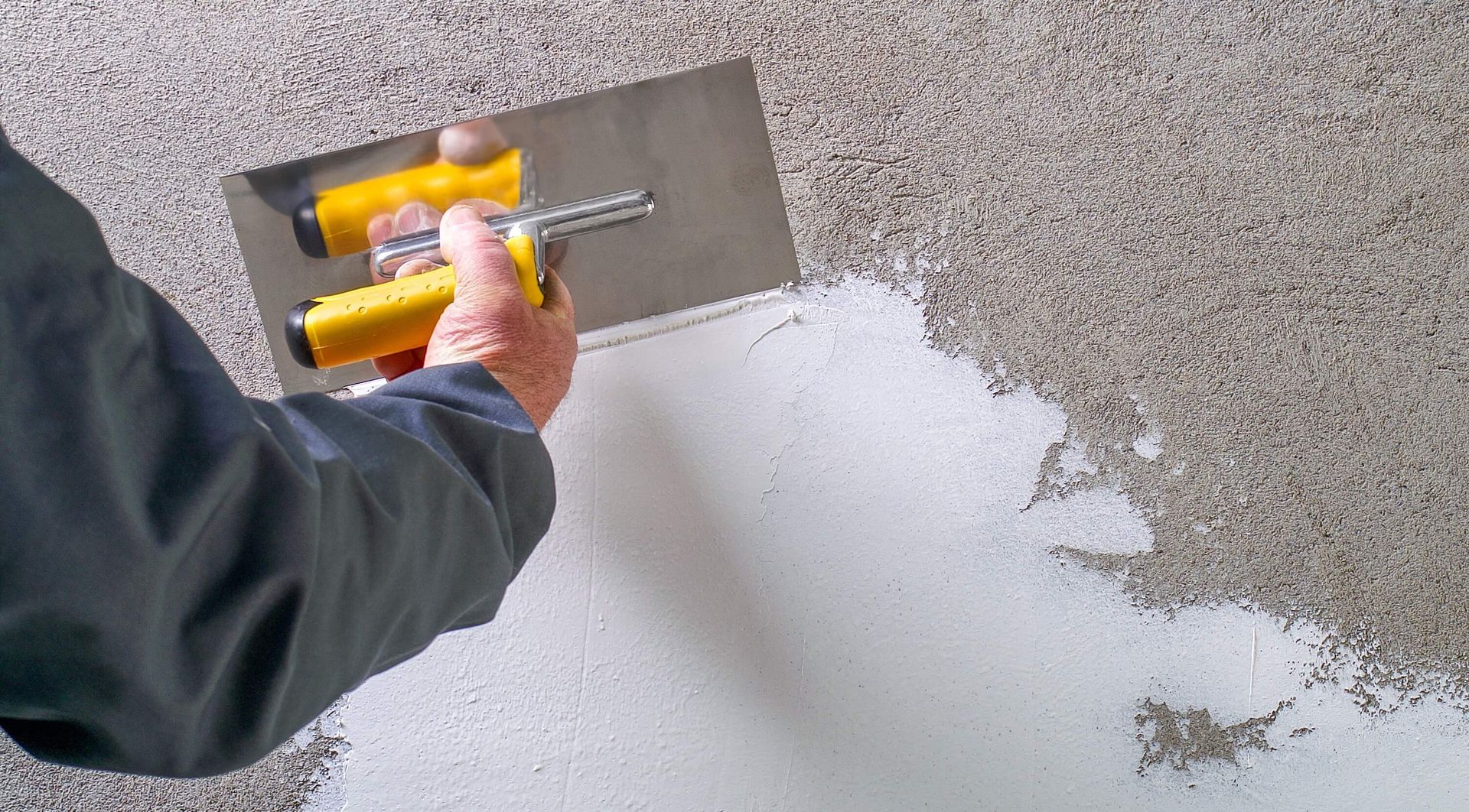 Contractor performing wall texturing services