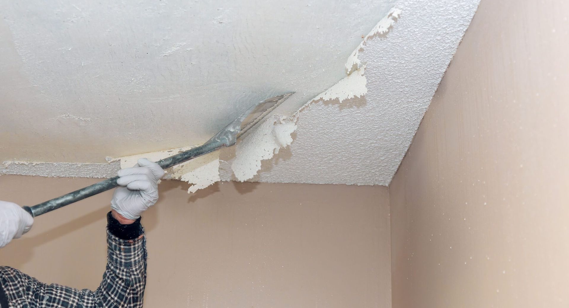 Outdated popcorn ceiling being removed in a Lakewood, CO Home