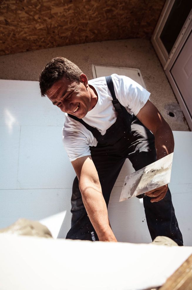 Sheetrock professional prepping for drywall installation