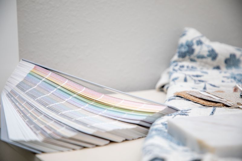 Luxurious living room with fireplace, piano, and chandelier.