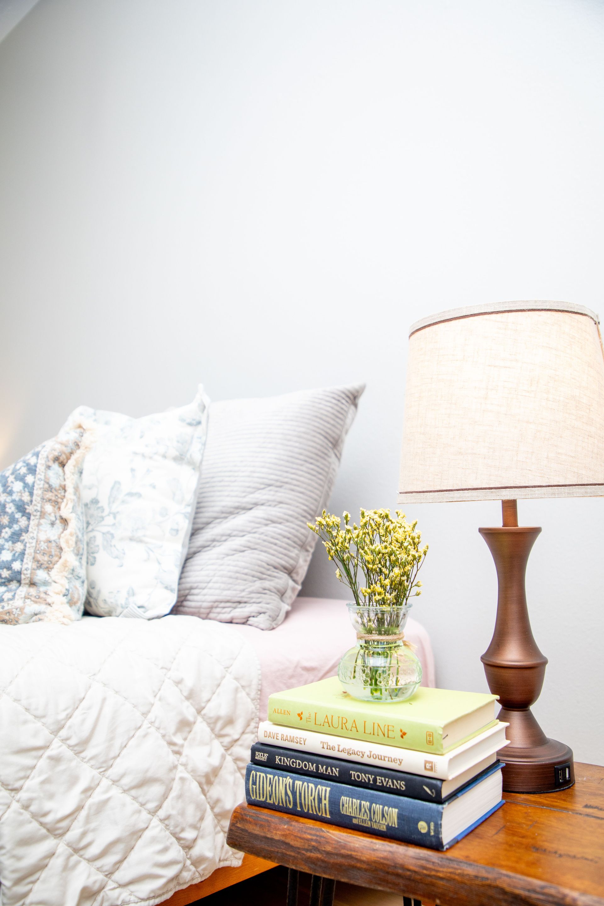 Kitchen interior, half-rendered in color, half-sketch, showing cabinets, island, appliances, and a chandelier.