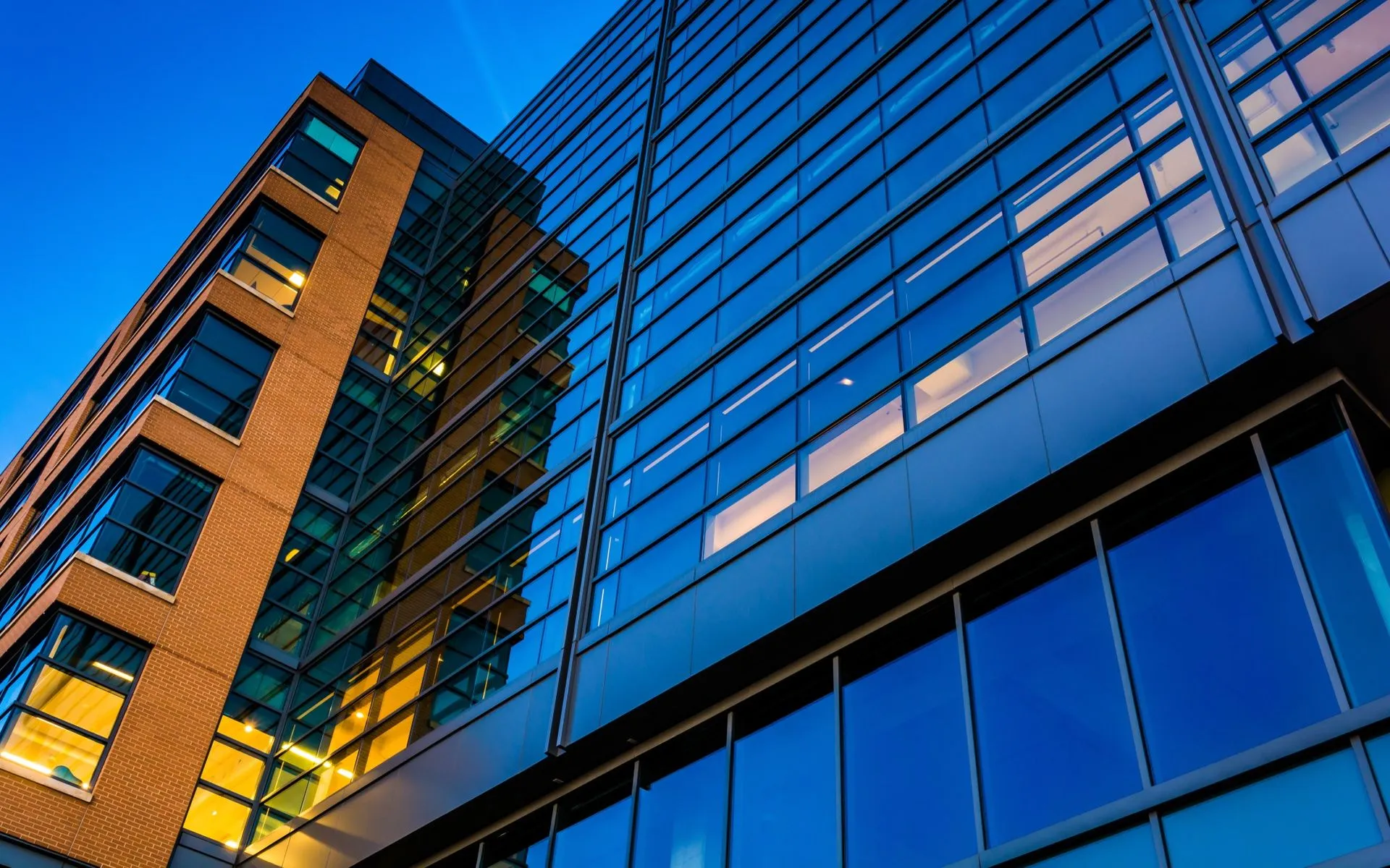 Modern commercial building lit at dusk in Maryland